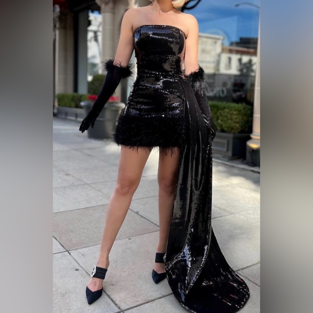 NADIME MIRABI - Elegant Black Sequin Top And Skirt with Feather Trim.